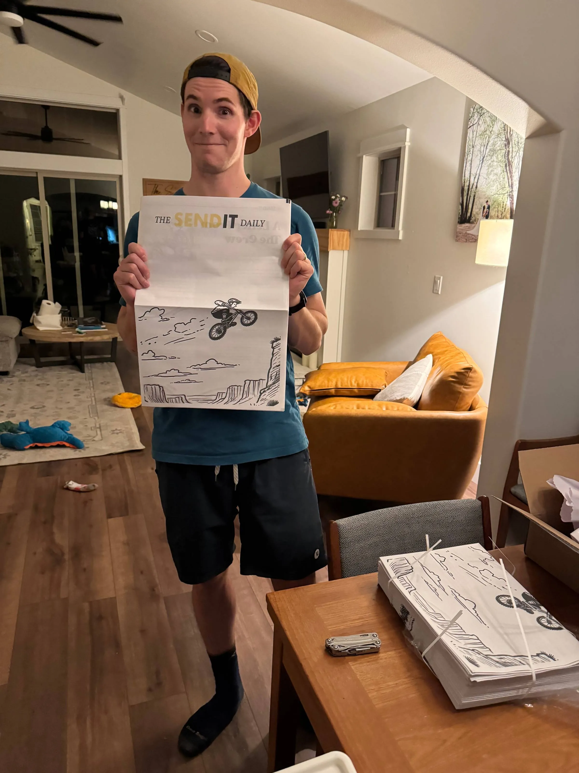 Ben late at night opening a large box of freshly printed newspapers