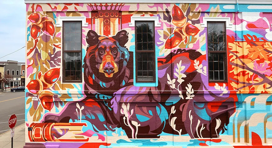 The “Wisdom” mural in Geneseo, NY by artist Key Detail