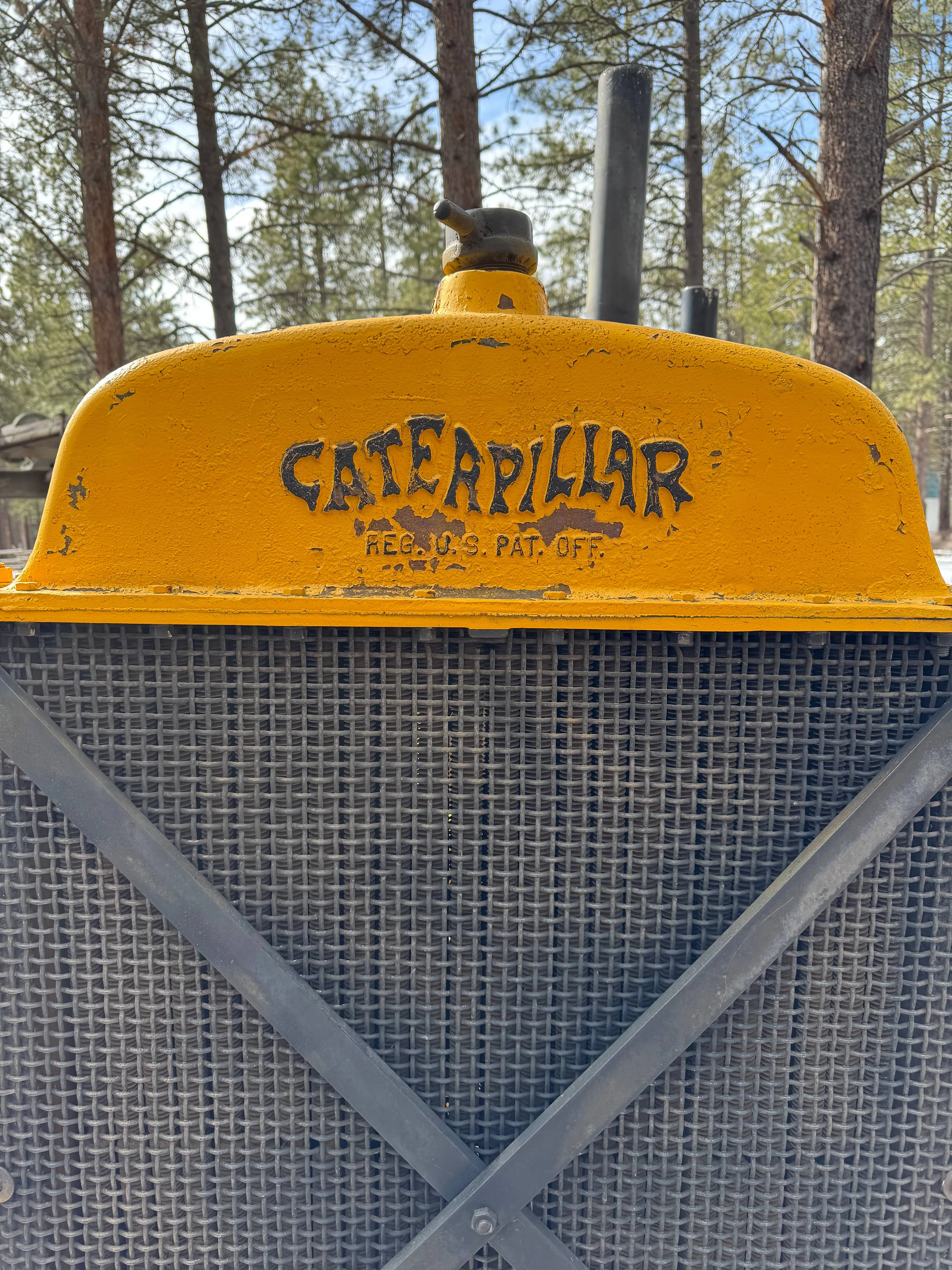 Vintage Caterpillar Cat tractor featuring the original caterpillar-shaped Caterpillar logo