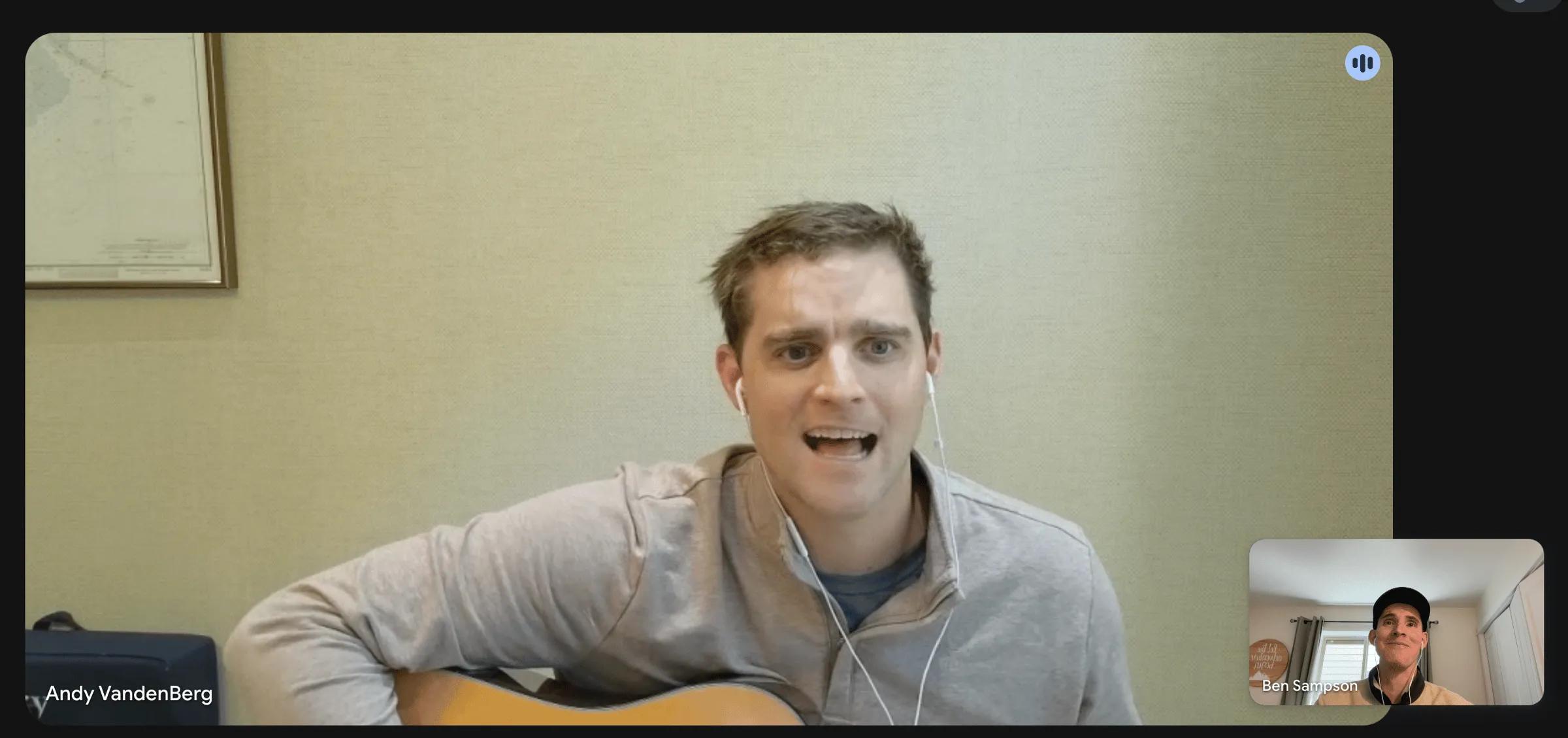 Video call screenshot of a man singing and playing an acoustic guitar, labeled Andy VandenBerg, while Ben Sampson watches from a smaller thumbnail in the corner.
