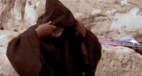 Star Wars GIF of Obi-Wan Kenobi standing in a hooded brown Jedi robe
