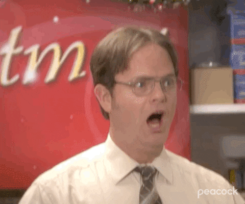 Dwight Schrute from The Office reacting with a wide-eyed, open-mouthed look of shock