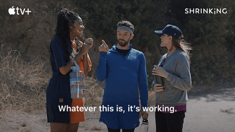 Animated clip from the Apple TV+ show “Shrinking” of three people talking on a trail with the caption “Whatever this is, it’s working.”